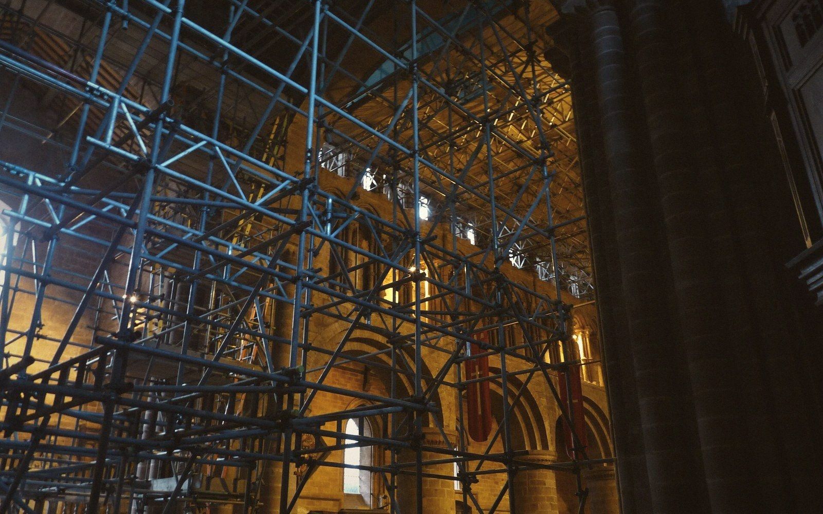 Scaffolding standing free inside a church nave